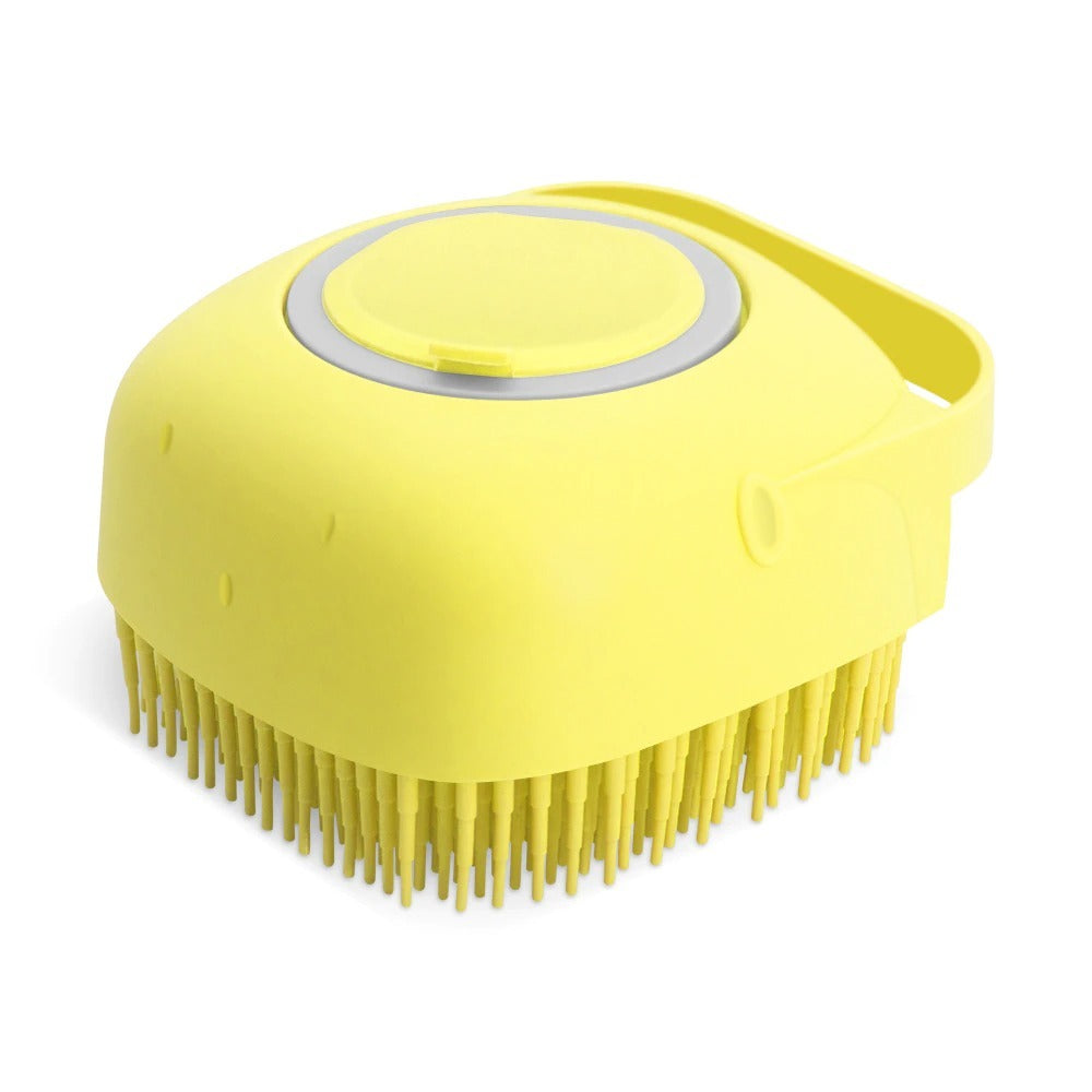 Gele siliconen shampoo- en massageborstel voor huisdieren, met zeepdispenserfunctie en zachte nopjes.